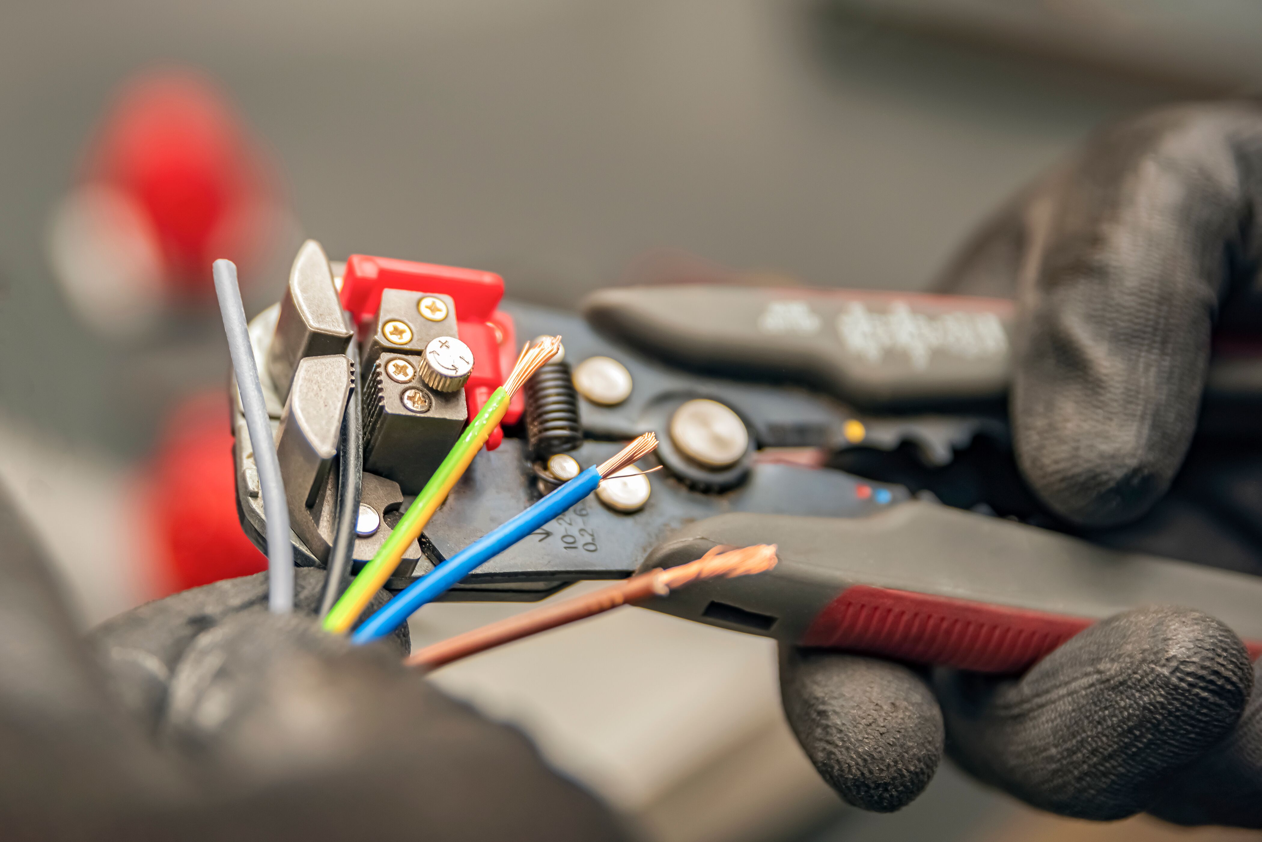 Custom Electrical Services  electrician in Utah fixing wires in a home..