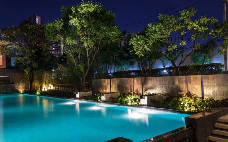 Gorgeous lighting and mood set when you light up your backyard pool at night.