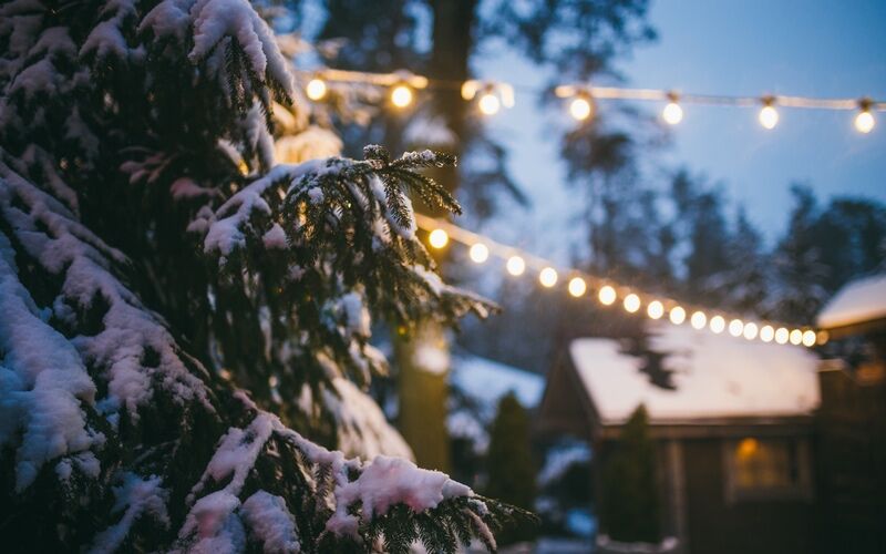 A gorgeous winter patio with string lights - tips from Custom Electrical Services .