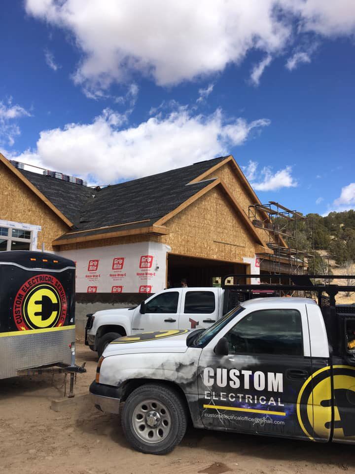 Custom Electrical parked outside a newly contructed home prepared to install their residential wiring in Utah.