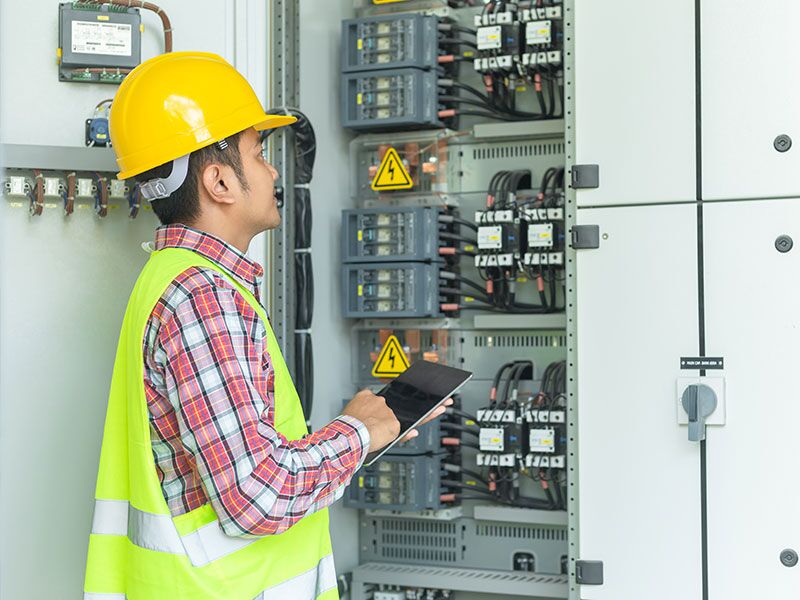 A Custom Electrical professional on the job.